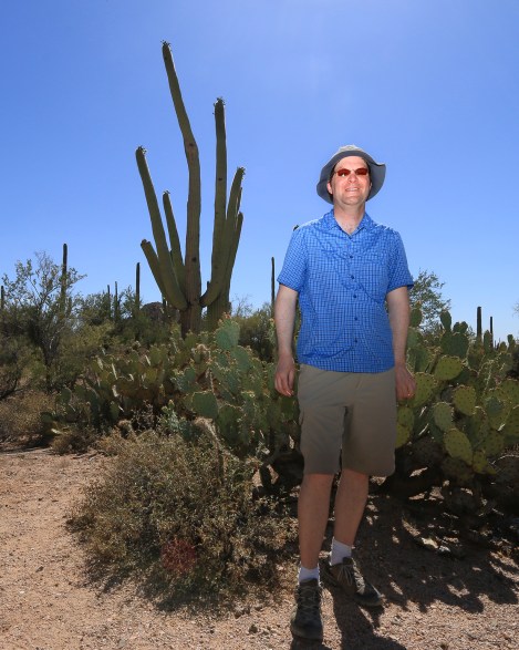 Stranger 42/100:Sebastian. Like myself, he is a nature enthusiast who was on a photowalk at the Valley View Overlook Trail at Saguaro National Park, West. We had an interesting encounter. It began with my first meeting his mother on the trail. She was a few steps ahead of me and when I caught her, discovered she was a German traveling with her husband and son. They were both was ahead of us on the trail. We caught up to them and reached an exciting subject: a low hanging open flower on a Saguaro cactus that was perfect for picture making. Most flower buds don't appear at human eye-level. The cactus don't produce the flowers until the life of the plant is anywhere from 35-75 years old, and they sprout at the top of the plant head, which can range in height from 20+ feet up. I noticed that the son was equipped like me with Canon equipment and he had some extension tubes on his main lens. I wanted to compare exposure notes (it was extremely bright in the 3 'o clock hour of hour meeting). So in my rough German, I began to speak and ask him a question. He appeared to ignore me. Mother put her hand on my shoulder and said in English, 