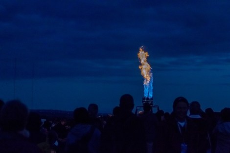 Spectators gather in the dark around balloon crews that are testing out the propane jets for the morning launch. You never know when to expect a blast. 1/400 sec at f/4.0, ISO 1250 | Canon EF 70-200mm f/4.0 L IS USM