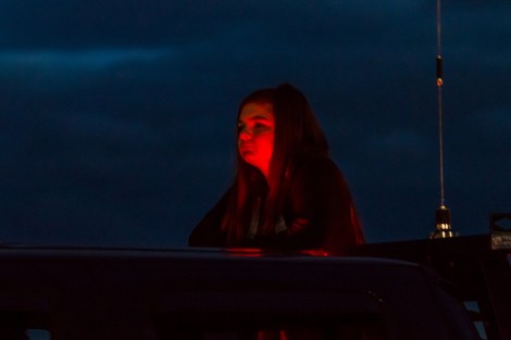Aboard a pickup truck enroute to a balloon setting up its basket and gas jets.