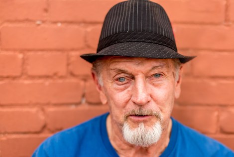 Stranger Portrait 65 of 100 is of TEX, an 80 year old man with a black fedora and goatee